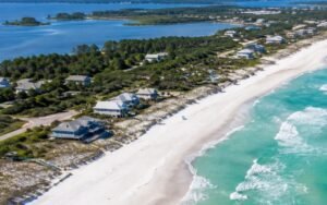 Low-rise beach community and white sand along Scenic Highway 30A in South Walton, Florida